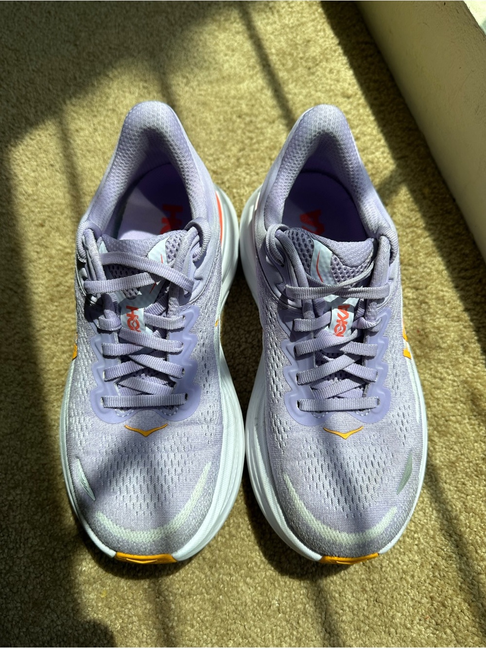 Hoka Lavender Athletic Running Shoes with Orange Accents
